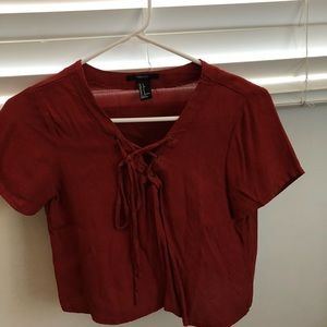 Orangish/red tie in the middle shirt